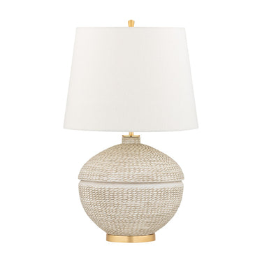 A beige ceramic table lamp with a Belgian linen shade and gold leaf accents.
